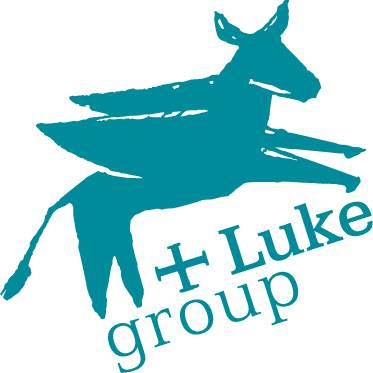 Svētā Lūkas atbalsta biedrības logotips ar spārnaina ēzeļa attēlu un uzrakstu"Luke group".